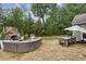 Inviting backyard with stone patio, fireplace and comfortable lounge area at 2579 Lulworth Ln, Marietta, GA 30062