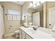 Bathroom featuring a wide mirror, white vanity, and neutral wall color at 2579 Lulworth Ln, Marietta, GA 30062