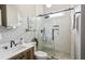 Modern bathroom featuring a glass shower with black fixtures and stylish wood vanity at 2579 Lulworth Ln, Marietta, GA 30062