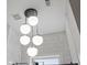 A shot showing the custom tile work, the shower head and the light fixture in the bathroom at 2579 Lulworth Ln, Marietta, GA 30062
