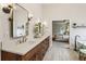 Bright bathroom with double sinks, modern fixtures, and a view into the main bedroom at 2579 Lulworth Ln, Marietta, GA 30062
