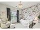 Cozy bedroom with floral wallpaper, and a chandelier; perfect for relaxation at 2579 Lulworth Ln, Marietta, GA 30062