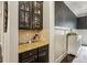 Butler's pantry with custom cabinets, granite countertops, and stylish backsplash at 2579 Lulworth Ln, Marietta, GA 30062