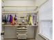 Walk-in closet features custom built shelving for clothes and accessories storage at 2579 Lulworth Ln, Marietta, GA 30062
