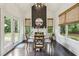 Charming dining area with a round table, natural light, and view to the backyard at 2579 Lulworth Ln, Marietta, GA 30062