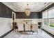 Elegant dining room features stylish chandelier, wainscoting, and ample natural light at 2579 Lulworth Ln, Marietta, GA 30062