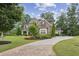 Beautiful brick two-story home with manicured lawn, mature trees, and inviting curb appeal at 2579 Lulworth Ln, Marietta, GA 30062