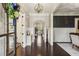 Elegant foyer with dark hardwood floors, decorative lighting, and an open layout at 2579 Lulworth Ln, Marietta, GA 30062