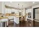 Bright kitchen featuring white cabinets, granite countertops, and modern stainless steel appliances at 2579 Lulworth Ln, Marietta, GA 30062