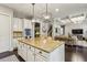 Stylish kitchen with a large island, granite countertops, and open access to the living area at 2579 Lulworth Ln, Marietta, GA 30062