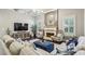 Cozy living room featuring a fireplace, comfortable seating, and large TV at 2579 Lulworth Ln, Marietta, GA 30062