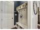 Welcoming mudroom featuring storage, coat hooks, and bench with a convenient space for shoes at 2579 Lulworth Ln, Marietta, GA 30062