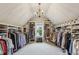 Bright and spacious walk-in closet with custom shelving, racks, and dressing area at 2579 Lulworth Ln, Marietta, GA 30062