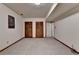 Finished basement with neutral carpet, closet and white trim at 2816 Highland Park Dr, Stone Mountain, GA 30087