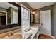 Well-lit bathroom featuring dual sinks, a window, and neutral tones at 2816 Highland Park Dr, Stone Mountain, GA 30087