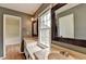 Well-lit bathroom featuring dual sinks, a window, and neutral tones at 2816 Highland Park Dr, Stone Mountain, GA 30087