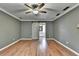 Spacious bedroom with hardwood floors and a ceiling fan at 2816 Highland Park Dr, Stone Mountain, GA 30087