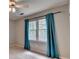 Cozy bedroom featuring plush carpeting and a window with natural light at 2816 Highland Park Dr, Stone Mountain, GA 30087