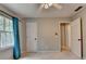 Cozy bedroom featuring plush carpeting and a window with natural light at 2816 Highland Park Dr, Stone Mountain, GA 30087