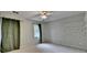 Neutral bedroom featuring a ceiling fan, window, built-in shelves and neutral carpet at 2816 Highland Park Dr, Stone Mountain, GA 30087