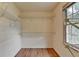 Spacious walk-in closet with multiple shelves and a window at 2816 Highland Park Dr, Stone Mountain, GA 30087