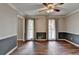 Empty dining room with hardwood floors, chair railing, ceiling fan, and natural light from the windows at 2816 Highland Park Dr, Stone Mountain, GA 30087
