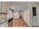 This dining area features plenty of room, stylish flooring and a stainless steel dishwasher at 2816 Highland Park Dr, Stone Mountain, GA 30087