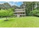 Charming two-story home with a welcoming front porch and a well-manicured lawn with mature landscaping at 2816 Highland Park Dr, Stone Mountain, GA 30087