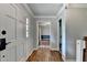 Inviting foyer featuring hardwood floors, white doors, and a view into adjacent living spaces at 2816 Highland Park Dr, Stone Mountain, GA 30087