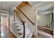 Foyer with hardwood floors, a staircase with carpeted steps, and an open view into other rooms at 2816 Highland Park Dr, Stone Mountain, GA 30087