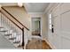 Foyer with hardwood floors, carpeted staircase, and a view into adjacent rooms at 2816 Highland Park Dr, Stone Mountain, GA 30087