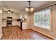 Bright kitchen with white cabinets, stainless steel appliances, and hardwood floors at 2816 Highland Park Dr, Stone Mountain, GA 30087