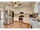 Stainless steel refrigerator, gas range and countertops accent this home's updated kitchen at 2816 Highland Park Dr, Stone Mountain, GA 30087