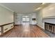 Spacious living room with fireplace, built-in shelves, and hardwood flooring at 2816 Highland Park Dr, Stone Mountain, GA 30087