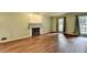 Spacious living room with fireplace, hardwood floors, and ample natural light at 2816 Highland Park Dr, Stone Mountain, GA 30087
