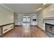 Bright living room with fireplace, built-in shelving, and hardwood floors at 2816 Highland Park Dr, Stone Mountain, GA 30087