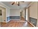 Spacious living room features new vinyl flooring, two-tone paint and an updated ceiling fan at 2816 Highland Park Dr, Stone Mountain, GA 30087