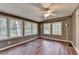 Sunroom featuring lots of windows and a ceiling fan at 2816 Highland Park Dr, Stone Mountain, GA 30087