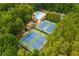 Overhead view highlighting community amenities: tennis courts, a clubhouse, and a refreshing pool at 2735 Jims Ne Rd, Marietta, GA 30066