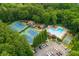 Aerial view of community amenities, including tennis courts and a sparkling swimming pool at 2735 Jims Ne Rd, Marietta, GA 30066