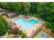 Aerial perspective of the community pool area, surrounded by ample seating and recreational spaces at 2735 Jims Ne Rd, Marietta, GA 30066