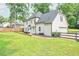 Back exterior view showing patio and attached garage, and fenced in yard at 2735 Jims Ne Rd, Marietta, GA 30066