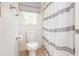 Clean bathroom featuring a toilet and shower and natural light from the window at 2735 Jims Ne Rd, Marietta, GA 30066