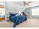 Spacious bedroom featuring a blue bed, window seat, and decor at 2735 Jims Ne Rd, Marietta, GA 30066