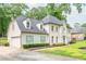 Charming two-story home with a two car garage, light green shutters, and landscaped front yard at 2735 Jims Ne Rd, Marietta, GA 30066