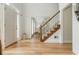 Sunlit foyer featuring hardwood floors and staircase and a view of the dining room at 2735 Jims Ne Rd, Marietta, GA 30066