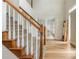 Grand foyer featuring hardwood floors, a staircase, and glass-paned French doors at 2735 Jims Ne Rd, Marietta, GA 30066