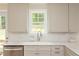 Bright kitchen area boasts white countertops, stainless steel appliances, and a window view at 2735 Jims Ne Rd, Marietta, GA 30066
