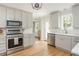 Contemporary kitchen with stainless steel appliances, white countertops and light wood floors at 2735 Jims Ne Rd, Marietta, GA 30066
