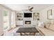Comfortable living room with fireplace, built-in bookshelves, ceiling fan and hardwood floors at 2735 Jims Ne Rd, Marietta, GA 30066